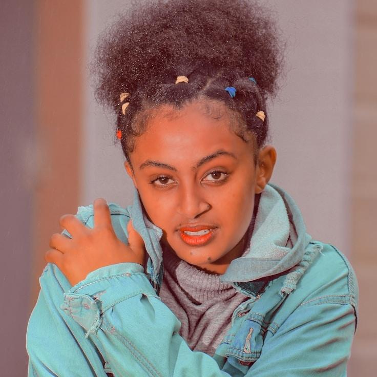 Kaveri Mehta, Lead Design Curator at IronCrestStudio, reviewing corporate floral arrangements